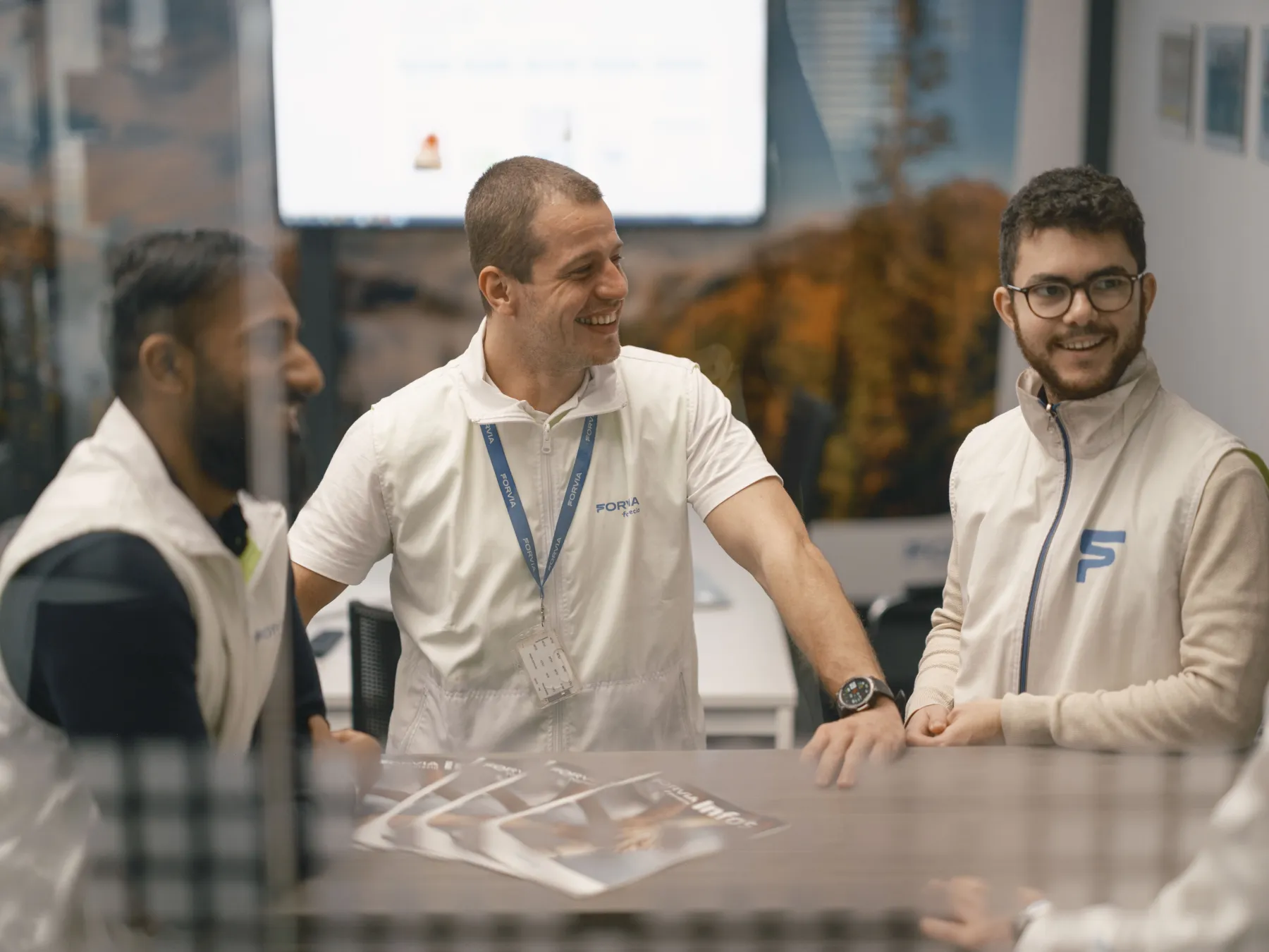 3 men during a break in a modern plant